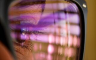 selective focus photography of man wearing eyeglasses