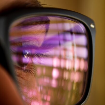 selective focus photography of man wearing eyeglasses