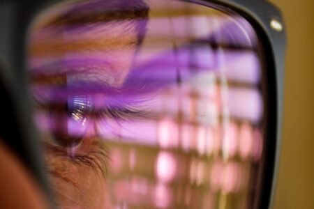 selective focus photography of man wearing eyeglasses