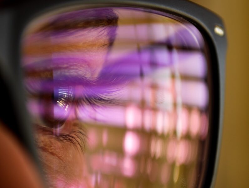 selective focus photography of man wearing eyeglasses