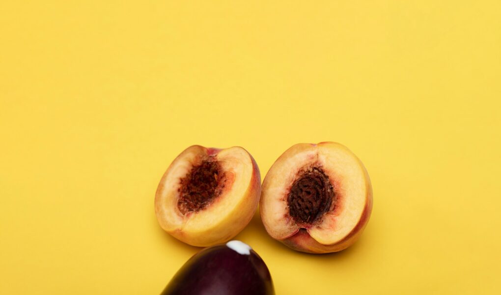 sliced fruit on yellow surface