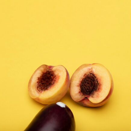 sliced fruit on yellow surface