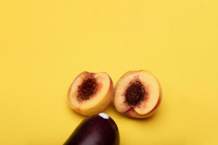 sliced fruit on yellow surface