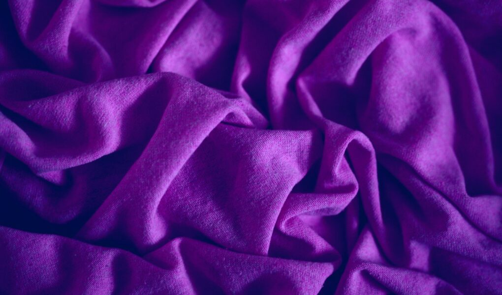 red textile in close up photography