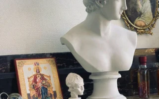 Wide shot of graffiti-adorned Narendra Modi Stadium, highlighting its expansive seating and cricket field.